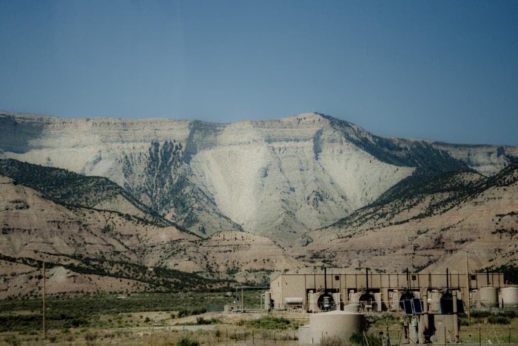 White desert mountains with cooling units at the base